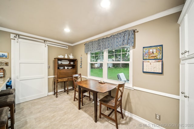 4721 S Irvington Pl, Tulsa, OK 74135 - dining space with a barn door, ornamental molding, and recessed lighting