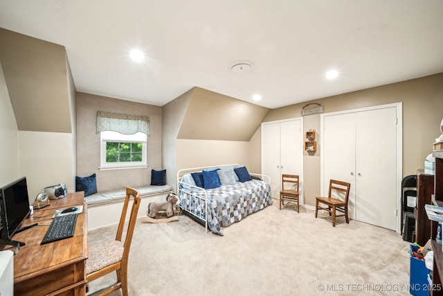 4721 S Irvington Pl, Tulsa, OK 74135 - bedroom featuring two closets, light carpet, recessed lighting, a desk, and vaulted ceiling