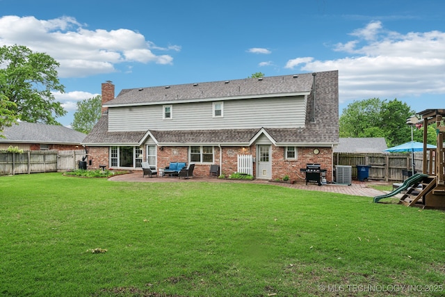 4721 S Irvington Pl, Tulsa, OK 74135 - back of property with a patio area, brick siding, and a fenced backyard