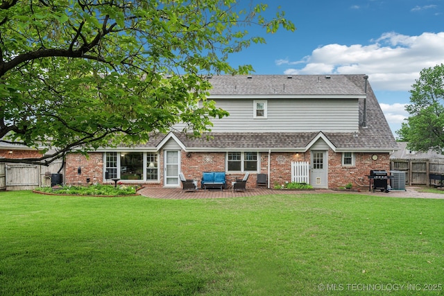 4721 S Irvington Pl, Tulsa, OK 74135 - back of property with a fenced backyard, brick siding, a shingled roof, outdoor lounge area, and a gate