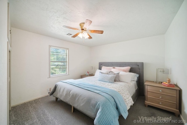 bedroom featuring baseboards, ceiling fan, visible vents, and carpet floors