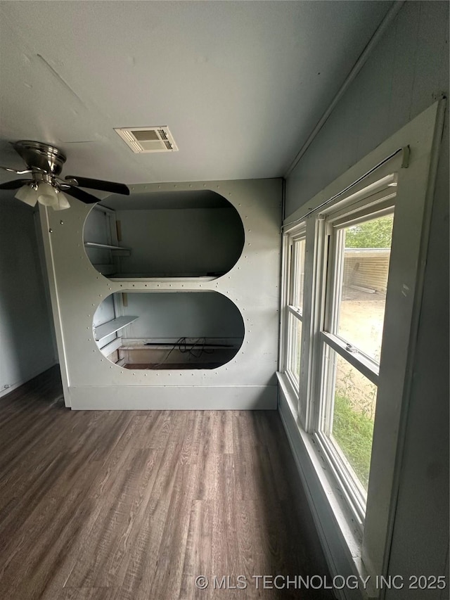 417 E SE, Ardmore, OK 73401 - detailed view of wood finished floors, baseboards, and a ceiling fan