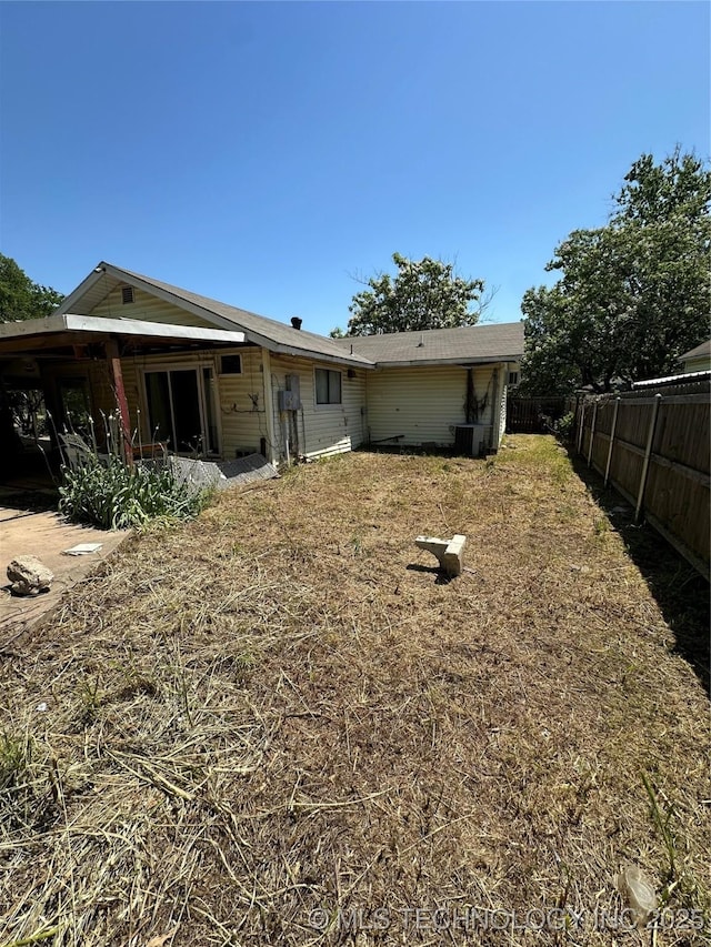 417 E SE, Ardmore, OK 73401 - rear view of property featuring fence and cooling unit