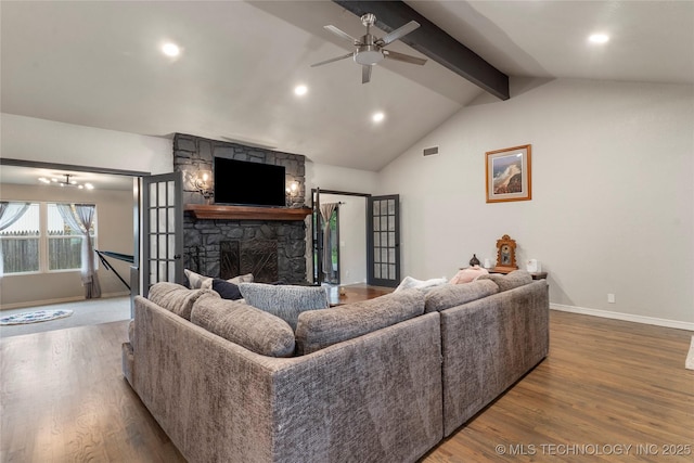living room featuring vaulted ceiling with beams, baseboards, visible vents, and wood finished floors