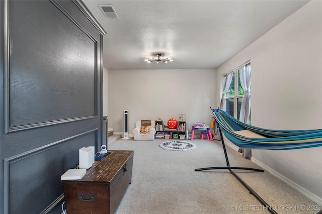 rec room with carpet flooring, baseboards, and visible vents
