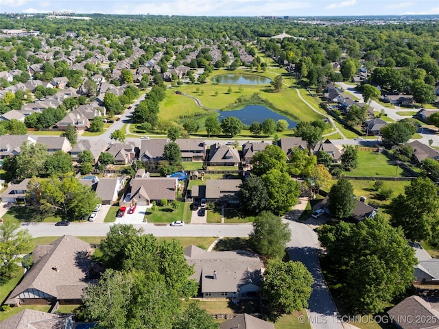 birds eye view of property with a water view and a residential view
