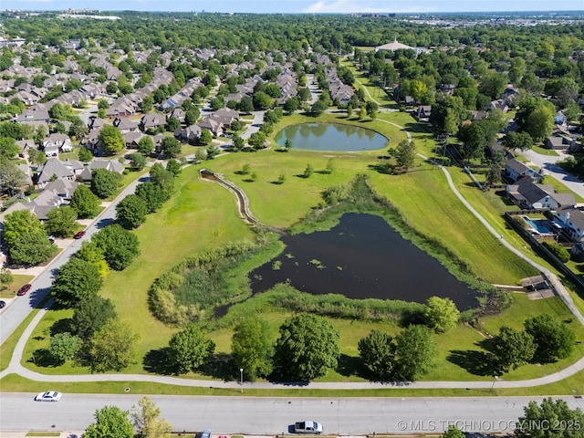 bird's eye view featuring a water view and a residential view