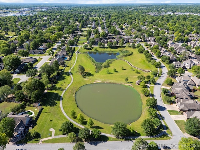 drone / aerial view with a water view and a residential view