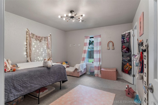 carpeted bedroom with an inviting chandelier and visible vents