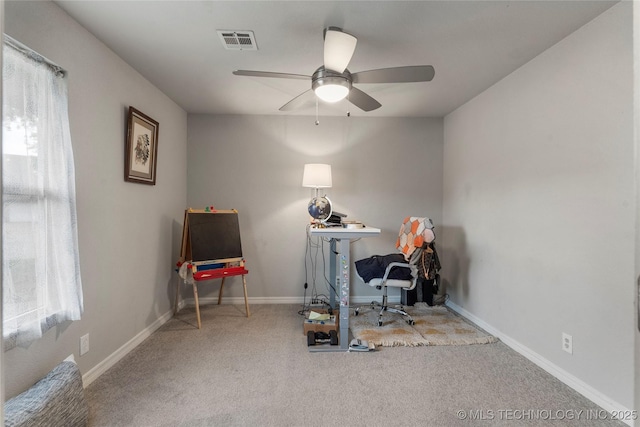 home office featuring plenty of natural light, visible vents, ceiling fan, and carpet floors