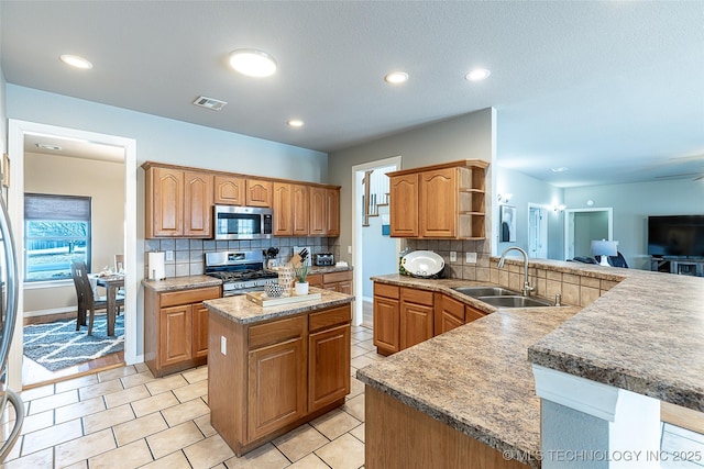 12285 N 164th E Pl, Collinsville, OK 74021 - kitchen with appliances with stainless steel finishes, a peninsula, backsplash, open shelves, and light tile patterned floors