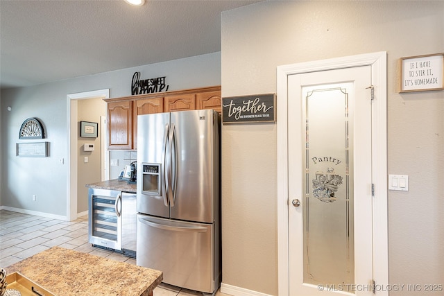 12285 N 164th E Pl, Collinsville, OK 74021 - kitchen with stainless steel refrigerator with ice dispenser, beverage cooler, and light tile patterned flooring