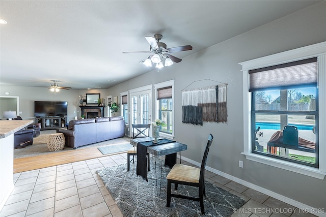 12285 N 164th E Pl, Collinsville, OK 74021 - dining room featuring ceiling fan, healthy amount of natural light, and light tile patterned floors