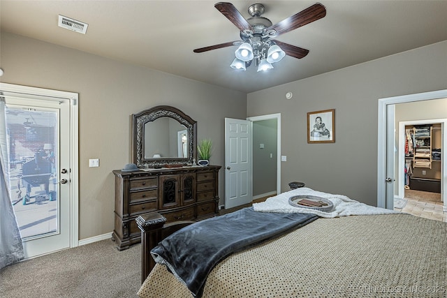 carpeted bedroom with access to outside, baseboards, a ceiling fan, and visible vents