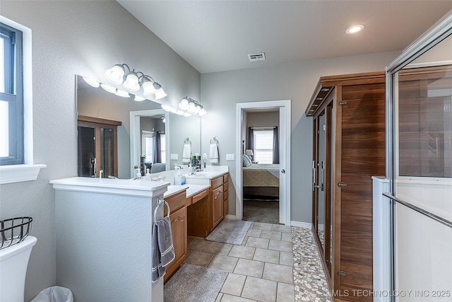 12285 N 164th E Pl, Collinsville, OK 74021 - bathroom featuring double vanity, connected bathroom, and tile patterned flooring