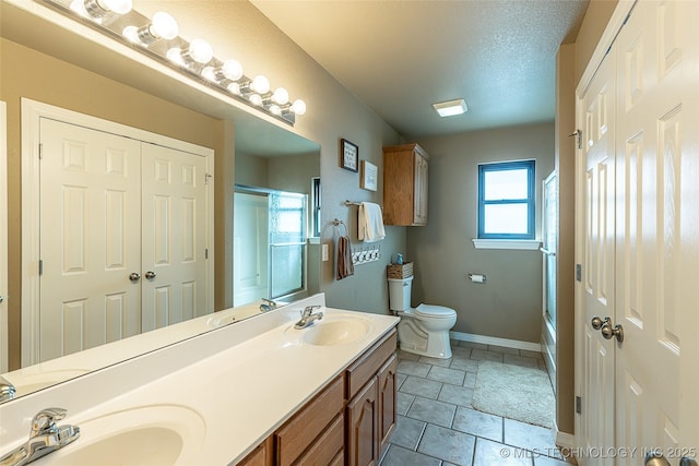 12285 N 164th E Pl, Collinsville, OK 74021 - full bath with double vanity, bath / shower combo with glass door, and tile patterned flooring
