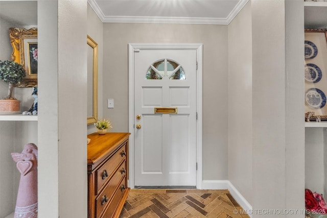 foyer entrance with ornamental molding and baseboards