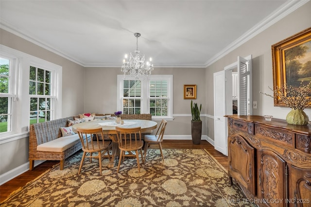 dining area with a chandelier, dark wood-type flooring, and a healthy amount of sunlight