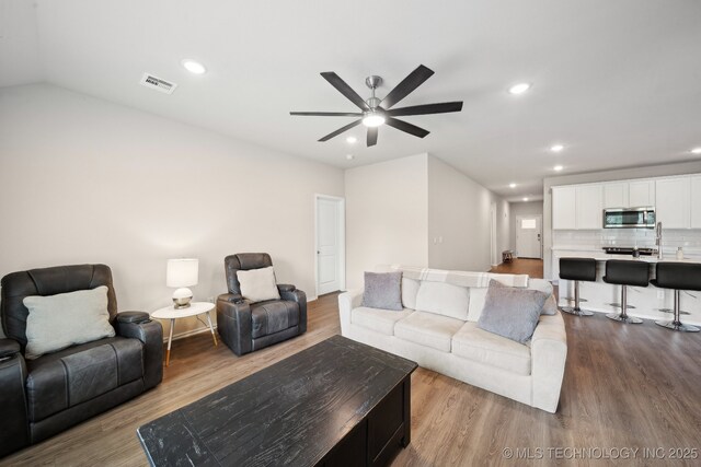 4218 W Village Park Dr, Skiatook, OK 74070 - living area with ceiling fan, recessed lighting, visible vents, and dark wood finished floors