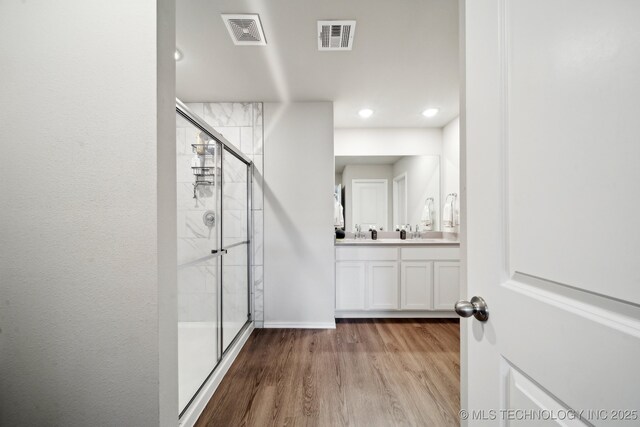 4218 W Village Park Dr, Skiatook, OK 74070 - hallway with visible vents, wood finished floors, baseboards, and recessed lighting