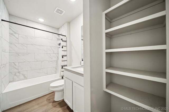 4218 W Village Park Dr, Skiatook, OK 74070 - full bath with shower / tub combo, toilet, visible vents, vanity, and wood finished floors