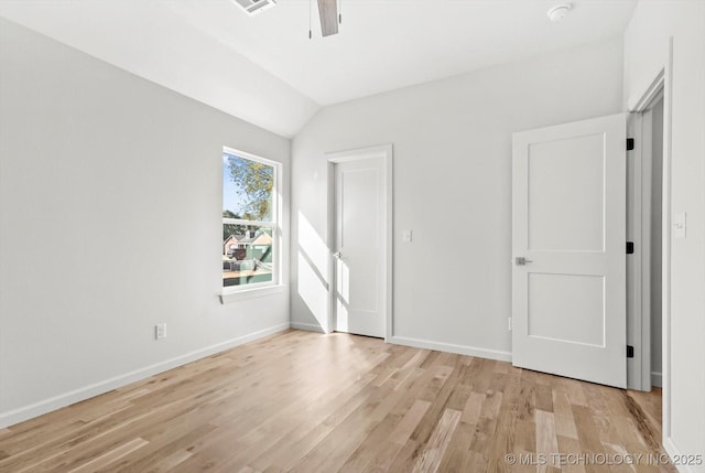 13242 E 4th Pl, Tulsa, OK 74108 - unfurnished bedroom featuring light wood-style flooring, baseboards, visible vents, ceiling fan, and vaulted ceiling