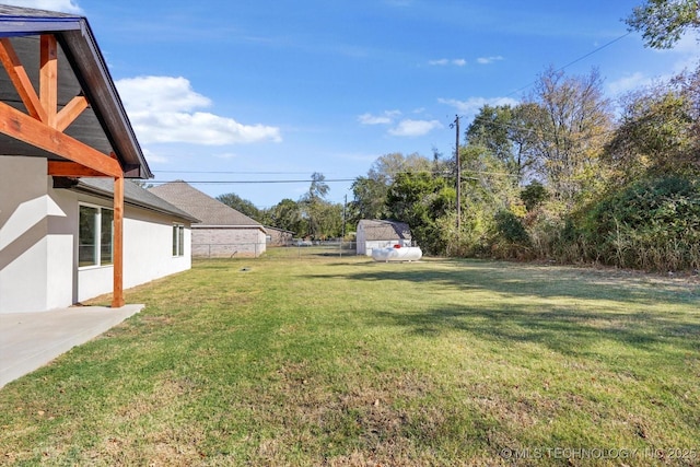 13242 E 4th Pl, Tulsa, OK 74108 - view of yard featuring a storage shed and an outbuilding