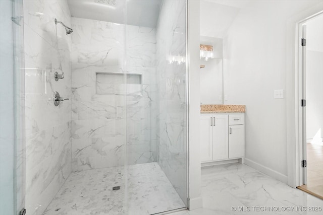 13242 E 4th Pl, Tulsa, OK 74108 - bathroom featuring vanity, a marble finish shower, marble finish floor, and baseboards