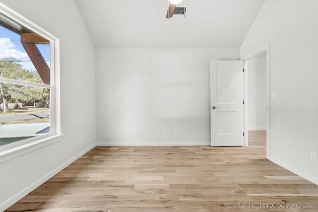 13242 E 4th Pl, Tulsa, OK 74108 - spare room with baseboards, ceiling fan, light wood-type flooring, and vaulted ceiling