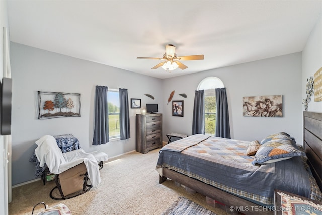 bedroom featuring carpet, baseboards, and ceiling fan