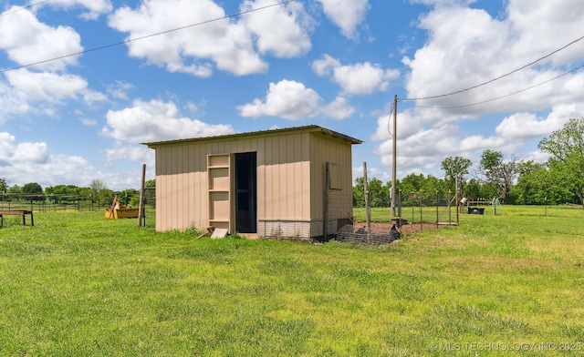 view of shed with fence