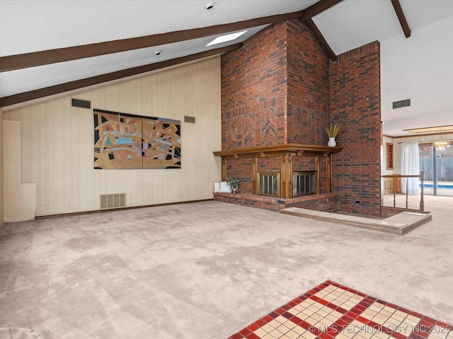 2600 Chapel Hill Rd, Bartlesville, OK 74006 - unfurnished living room featuring high vaulted ceiling, a brick fireplace, beam ceiling, and carpet floors
