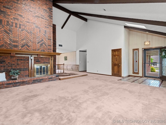 2600 Chapel Hill Rd, Bartlesville, OK 74006 - unfurnished living room featuring high vaulted ceiling, carpet, beamed ceiling, a brick fireplace, and baseboards