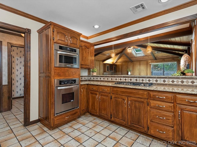 2600 Chapel Hill Rd, Bartlesville, OK 74006 - kitchen with appliances with stainless steel finishes, brown cabinets, baseboards, crown molding, and light tile patterned floors
