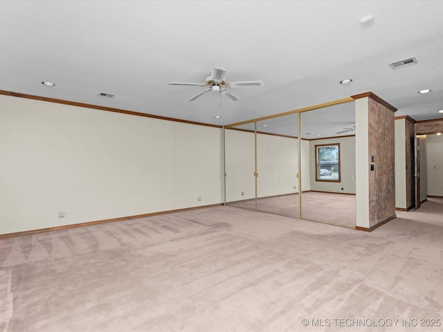 2600 Chapel Hill Rd, Bartlesville, OK 74006 - spare room with light colored carpet, crown molding, a ceiling fan, recessed lighting, and baseboards