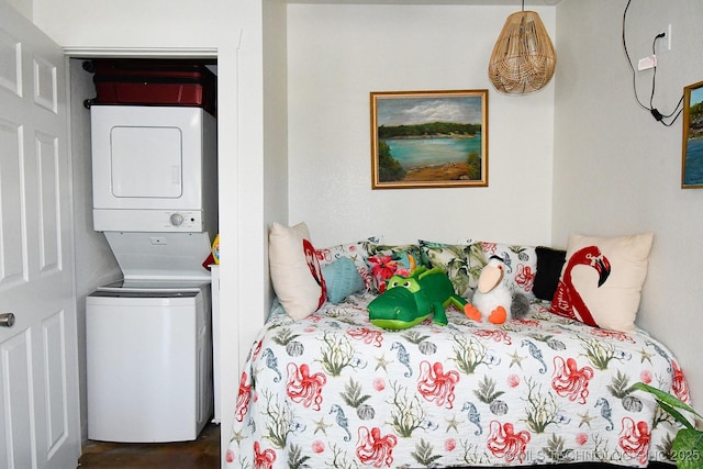 bedroom with stacked washer and dryer