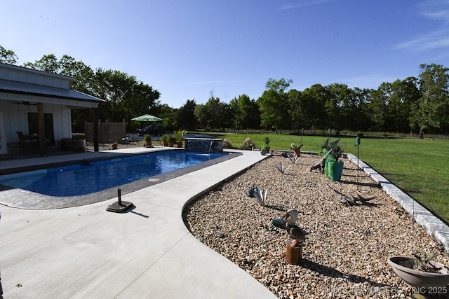 outdoor pool featuring a yard and a patio area