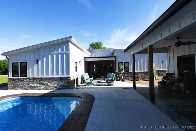 pool featuring a ceiling fan and a patio area