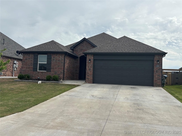 4242 W Village Park Dr, Skiatook, OK 74070 - ranch-style home featuring a shingled roof, driveway, an attached garage, and a front lawn