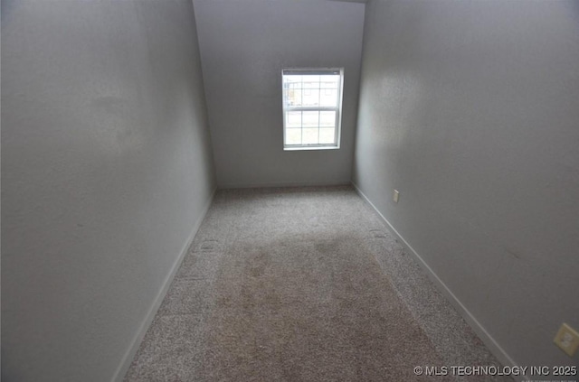 spare room with carpet flooring and baseboards