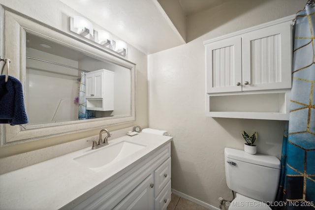 full bathroom with vanity, toilet, baseboards, a shower with shower curtain, and tile patterned floors