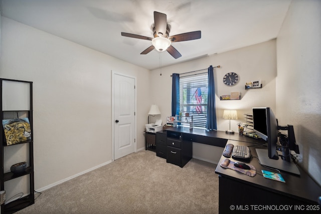 office with ceiling fan, light carpet, and baseboards