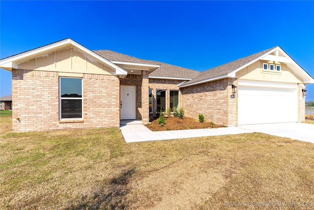 single story home with a garage, a shingled roof, a front yard, brick siding, and driveway