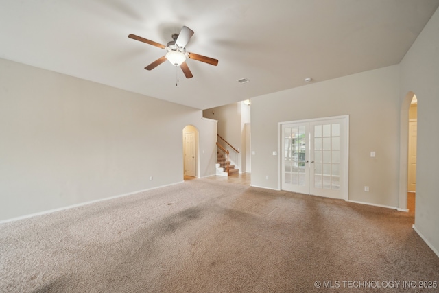 4712 N Narcissus Ave, Broken Arrow, OK 74012 - unfurnished living room featuring arched walkways, a ceiling fan, and carpet floors