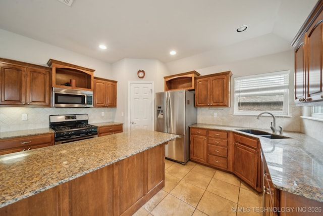 4712 N Narcissus Ave, Broken Arrow, OK 74012 - kitchen featuring stainless steel appliances, open shelves, a sink, light stone countertops, and recessed lighting