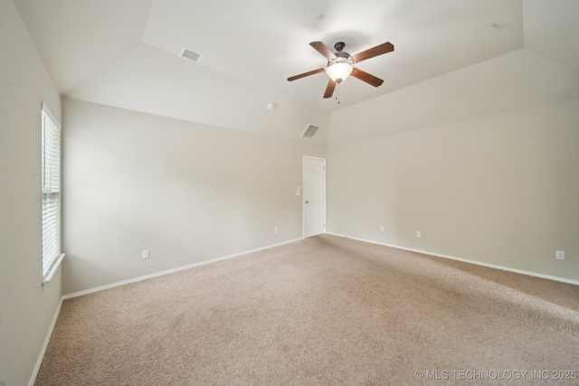 4712 N Narcissus Ave, Broken Arrow, OK 74012 - spare room featuring vaulted ceiling, carpet floors, ceiling fan, healthy amount of natural light, and baseboards