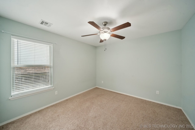 4712 N Narcissus Ave, Broken Arrow, OK 74012 - carpeted spare room with healthy amount of natural light, ceiling fan, and baseboards