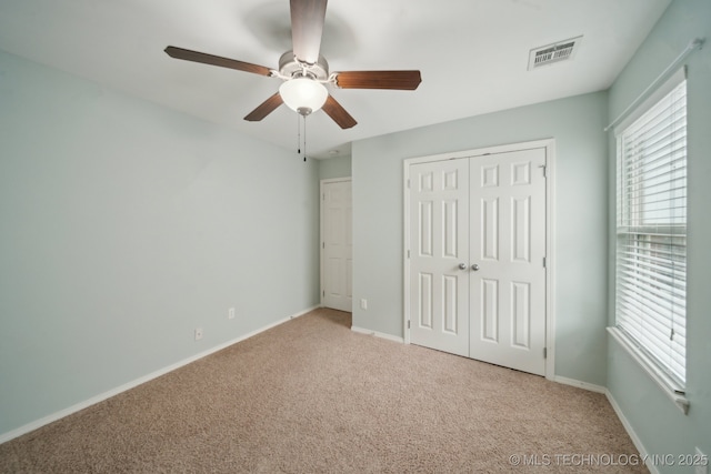 4712 N Narcissus Ave, Broken Arrow, OK 74012 - unfurnished bedroom with light colored carpet, a closet, and baseboards