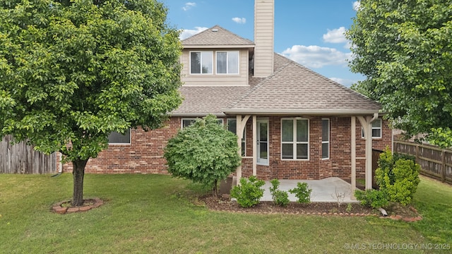 4712 N Narcissus Ave, Broken Arrow, OK 74012 - view of front of property featuring a shingled roof, a chimney, a patio, and brick siding