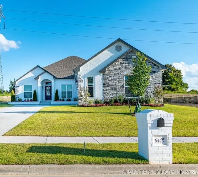 6442 E 148th St S, Bixby, OK 74008 - view of front of property featuring a front yard and stone siding